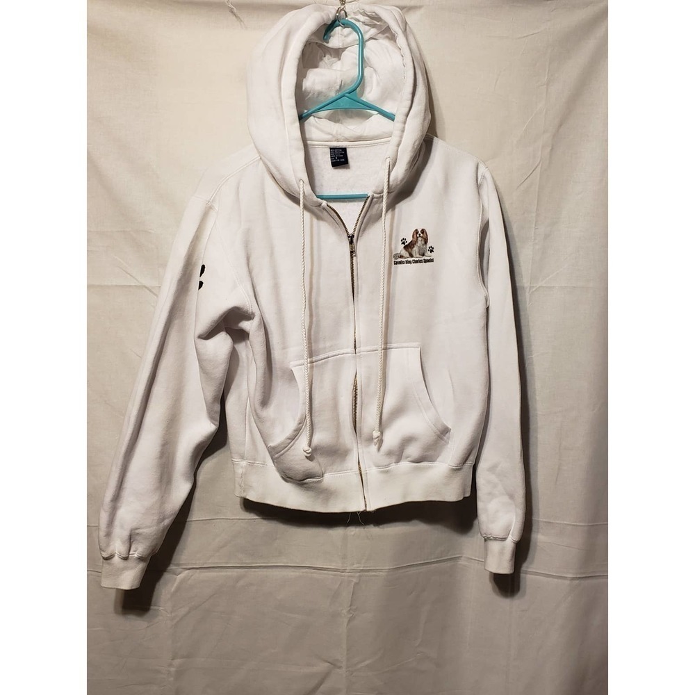 Small white zippered hoodie. King Charles spaniels on it.
